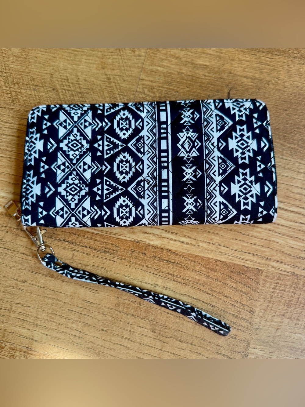 Black and white Navajo pattern zip up wallet with wristlet.